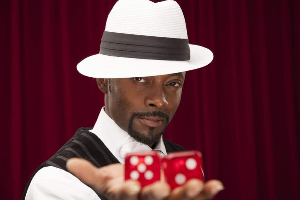 Man handing dice for use as a safe password generator