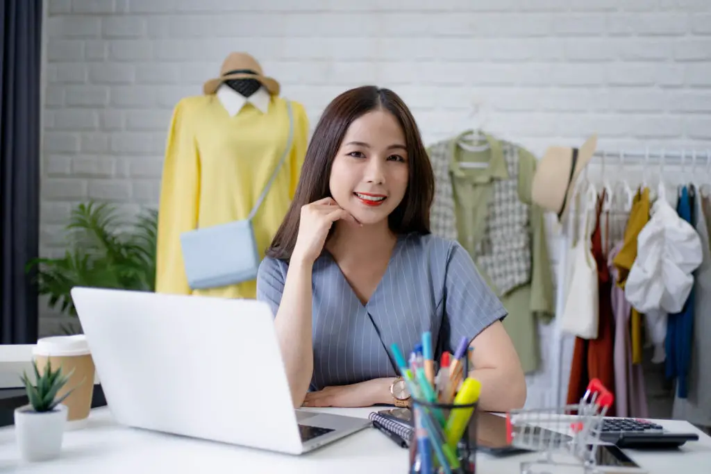 Woman with small business using laptop.