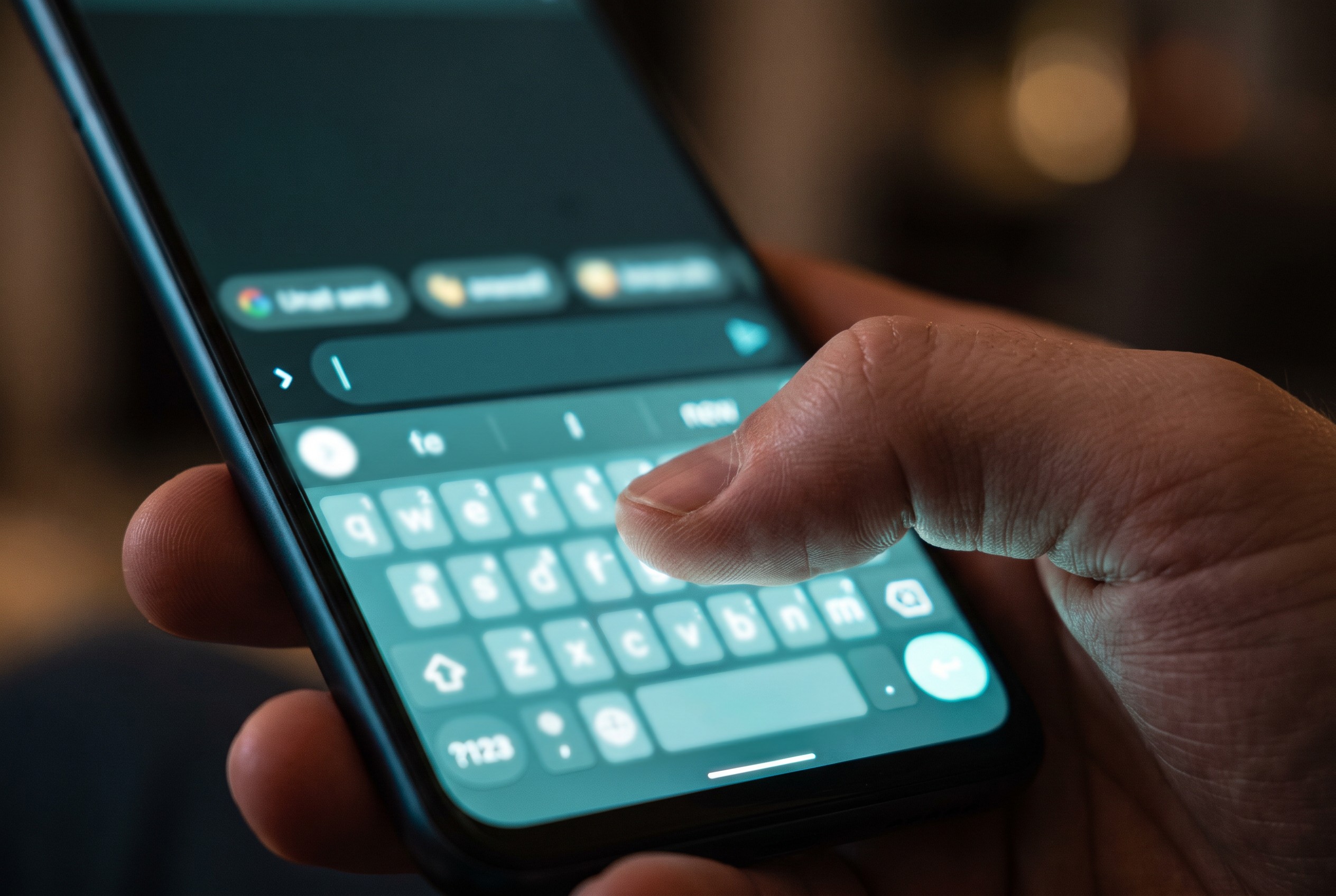 Close-up of a private keyboard on an Android text field, keyboard suggestions visible while typing