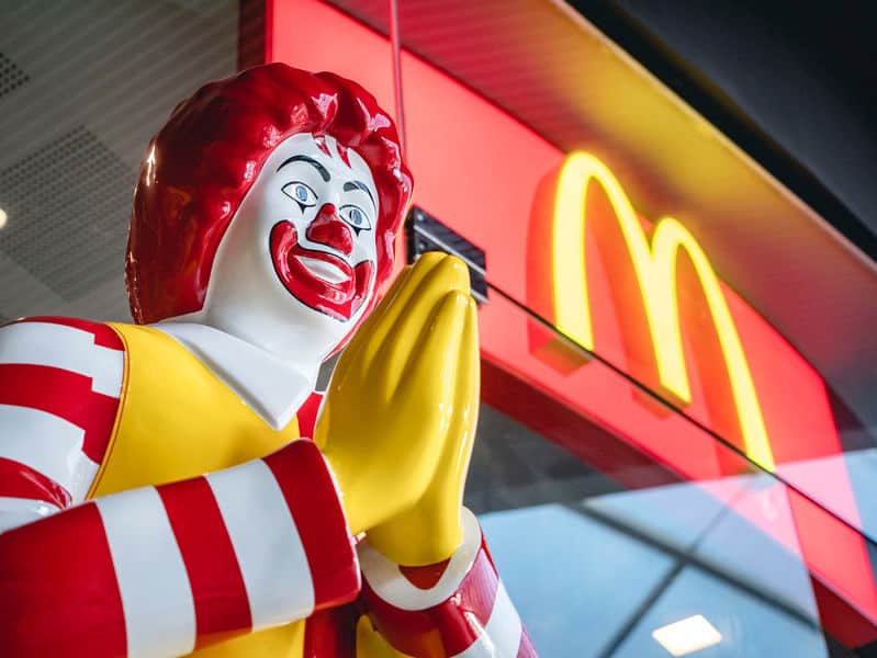 Ronald McDonald statue in Bangkok, Thailand McDonalds restaurant with praying hands in somewhat creepy expression