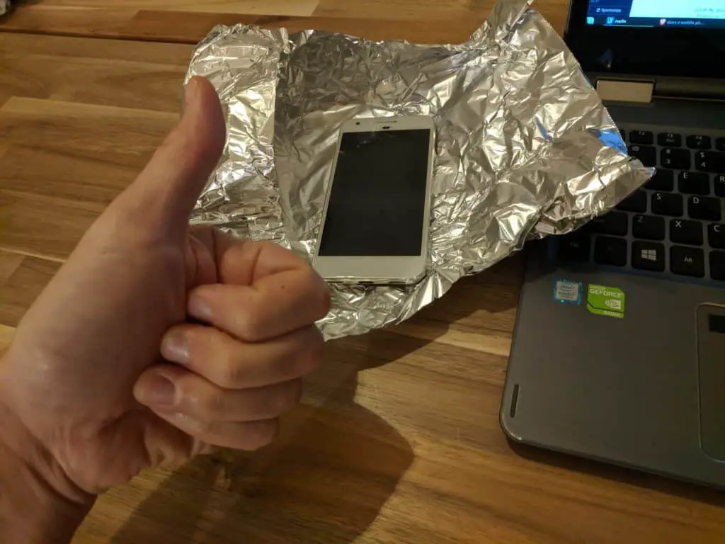 Photo of my phone laying in a piece of aluminum foil after testing if it could be tracked while wrapped