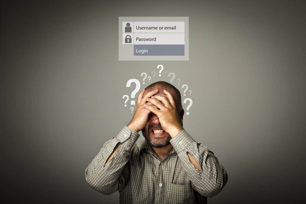 Man covering face frurstrated at safe password generating