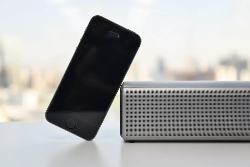 Smartphone leaning on a nfc bluetooth speaker
