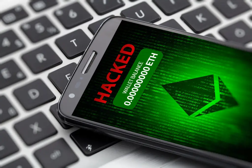 Ethereum wallet hacked message on smart phone screen.