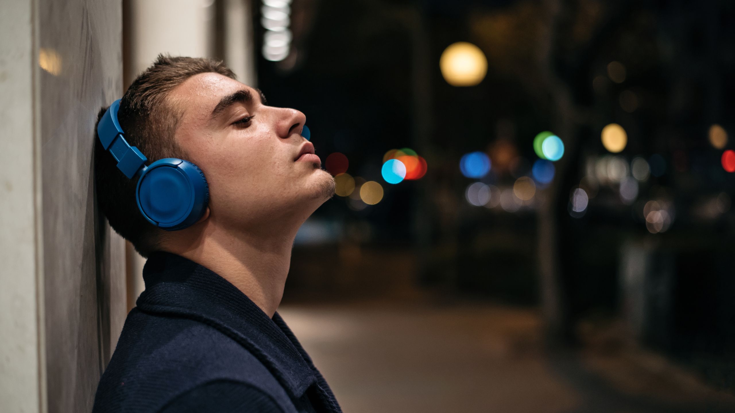Young man with bluetooth headphones