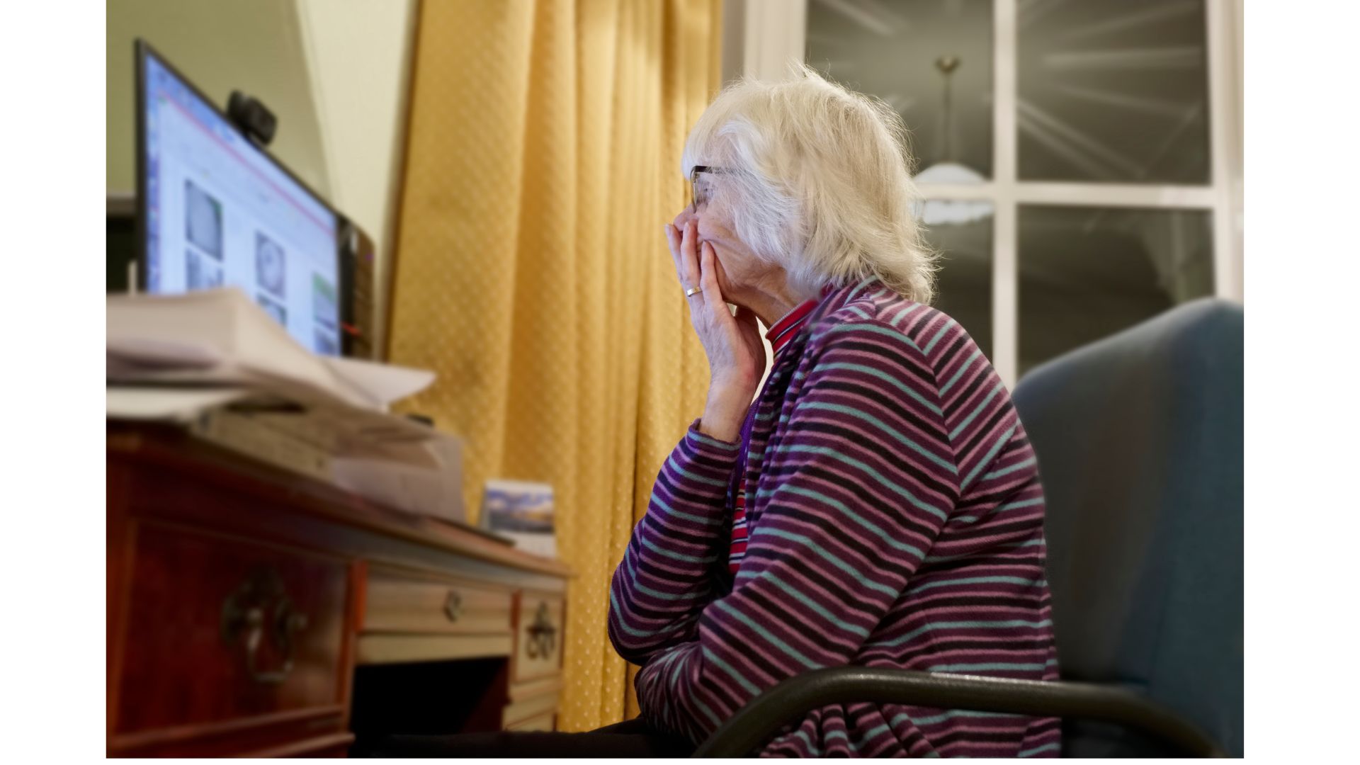 Old elderly lady distraught after being a victim of a mobile banking app scam.